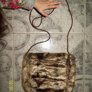 CARTERA ATIGRADA 22 X 22 CM CON SOLAPA      2900.00 $